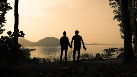 Silhouette of a tourist couple at Chandil Dam